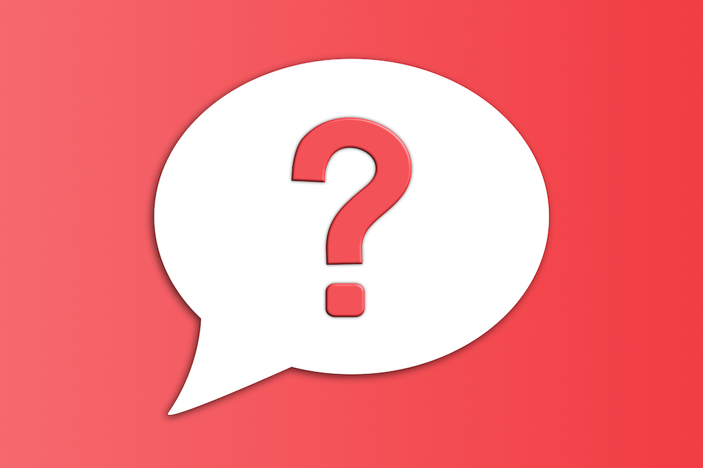 Question mark in white speech bubble with red background. 