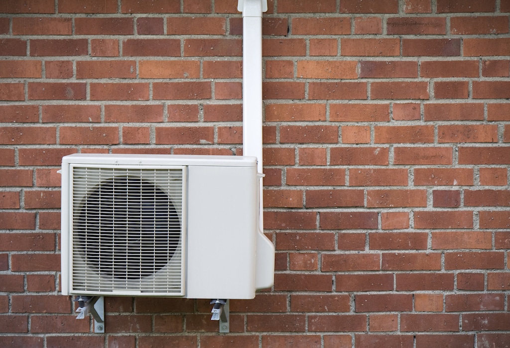 Heat pump on brick house. | Heat Pump Service Checklist