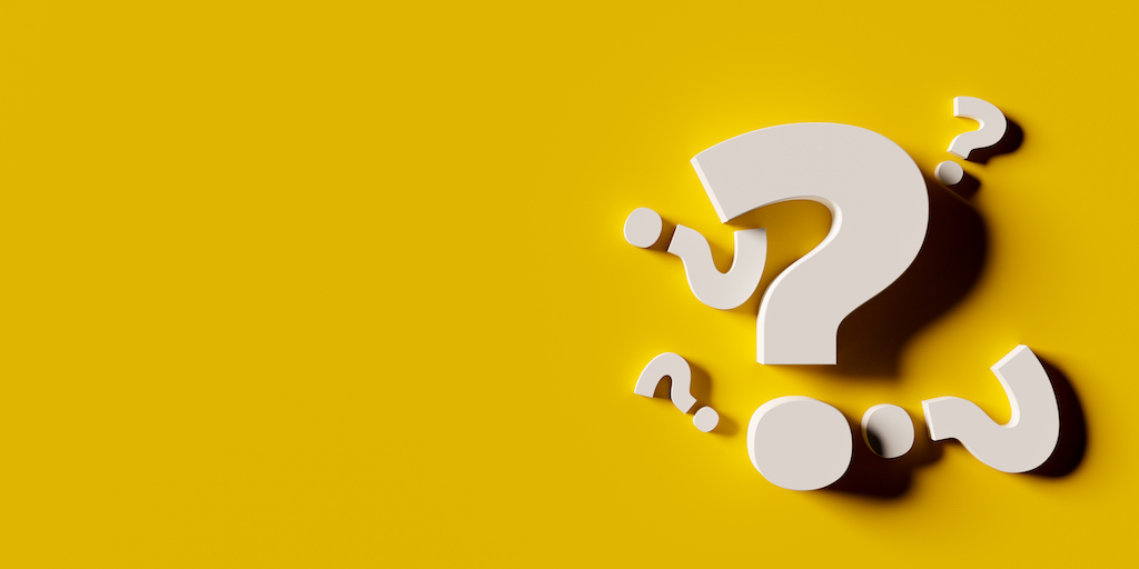 White question marks with yellow background. | Central Heating Servicing