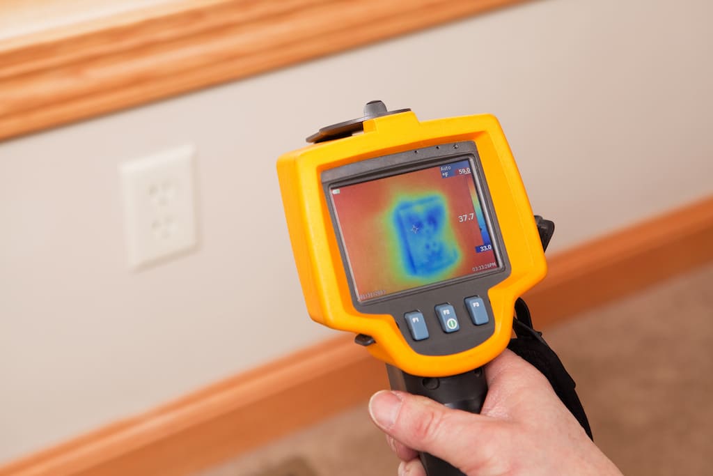 An infrared thermal imaging system being used during a home energy audit. AC repair