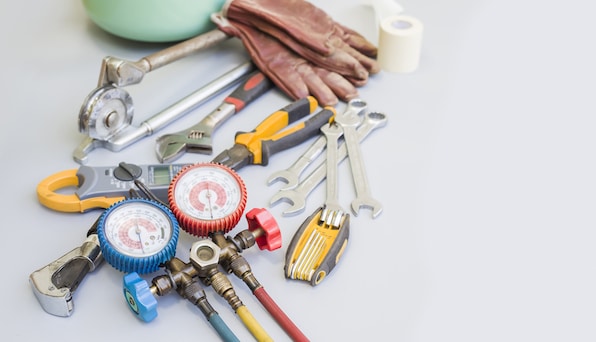 Tools for AC repair company to fix ac unit. Blank background. 