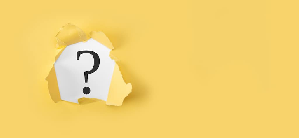 Yellow background with question mark for AC repair company FAQs