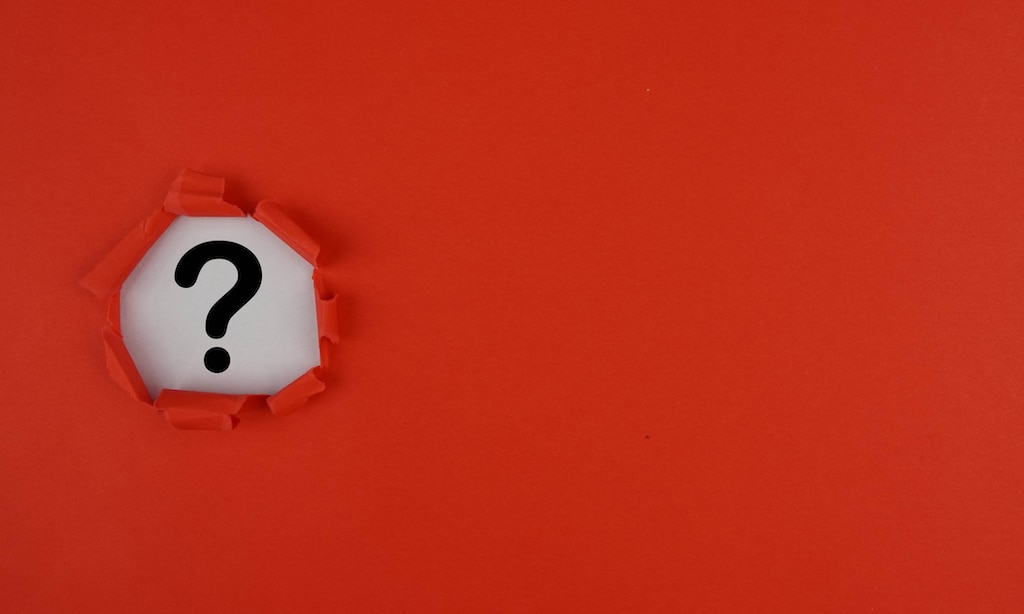 Red backdrop with question mark representing questions about Air Conditioning for Homes with Boilers Service