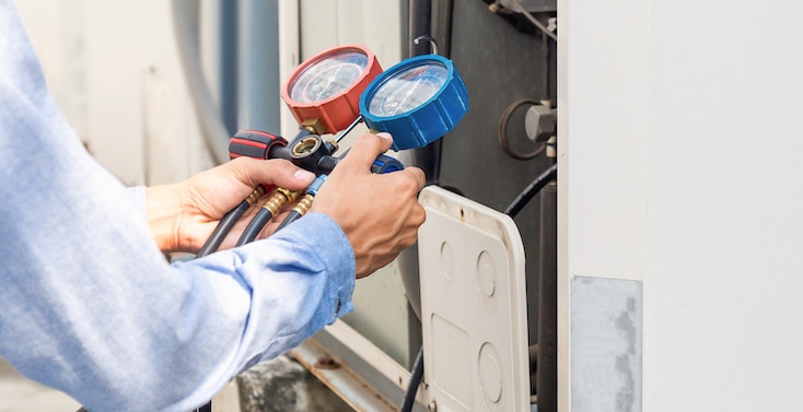 Hands checking on hvac repair. | Residential HVAC Installation