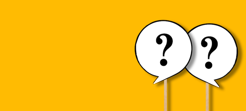 Two question marks on wooden sticks and yellow background. | Air Conditioning Service