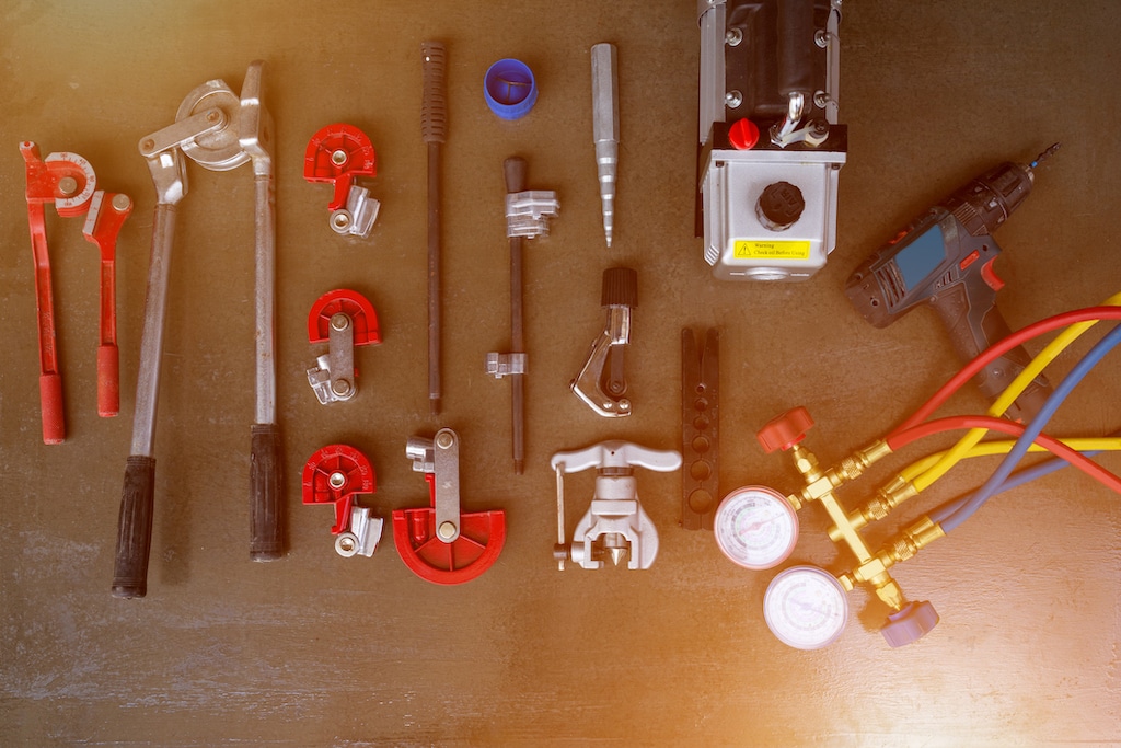 Various HVAC tools sitting on table. | Air Conditioning Service