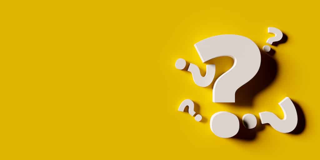 White question marks with yellow background. | Central Heating Servicing