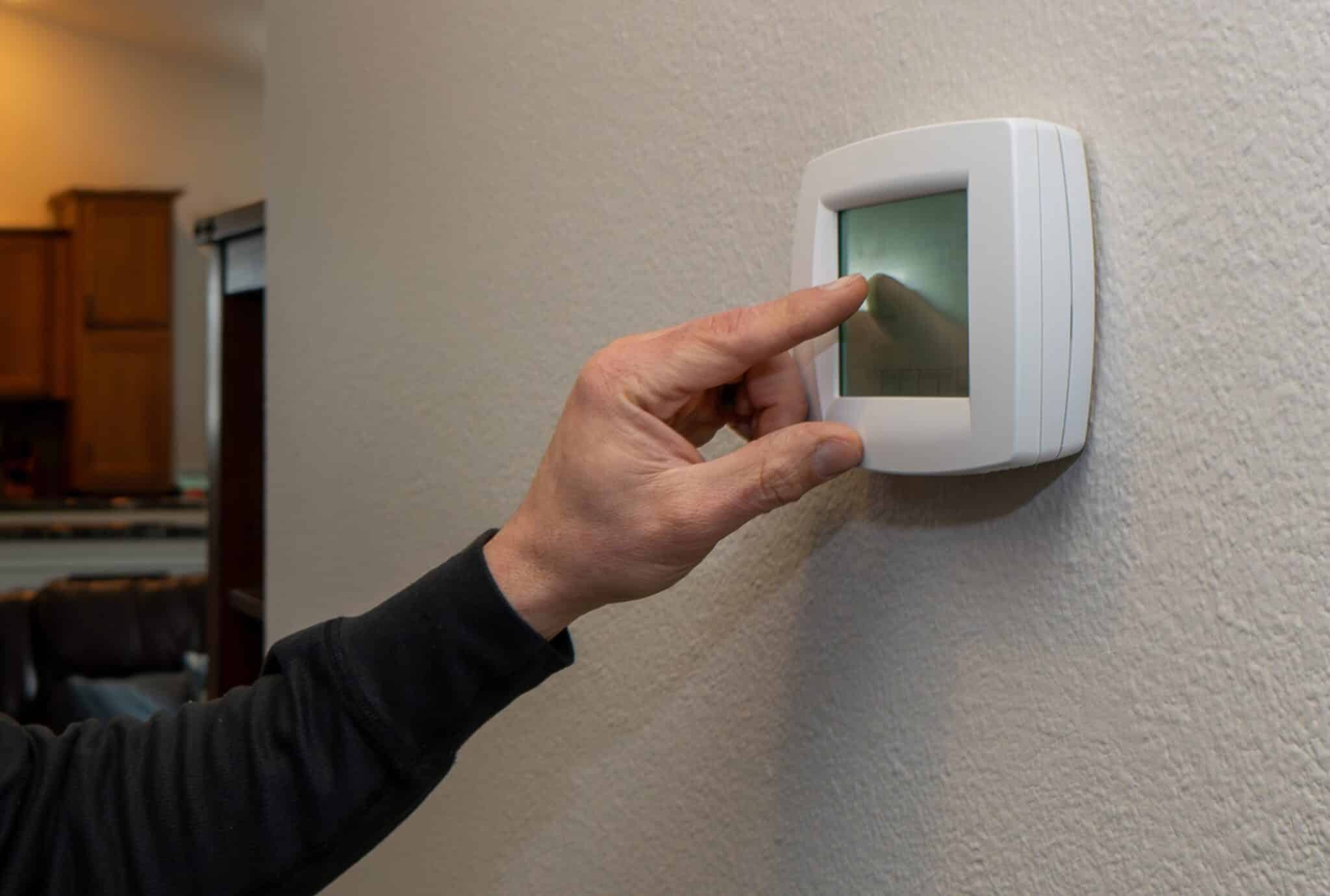 Home thermostat near living room, Zone Heating.