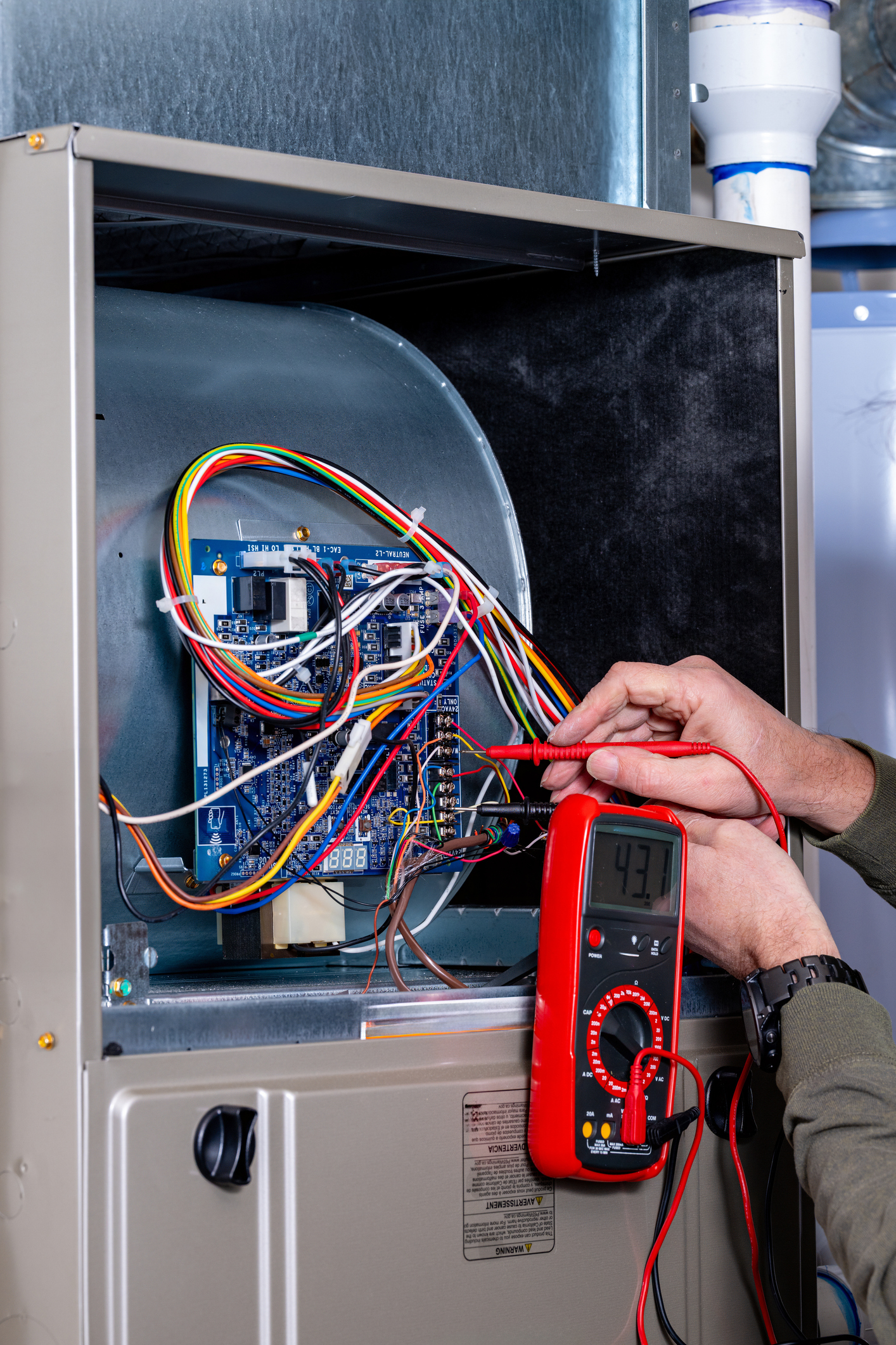 HVAC electrician inspecting a system and identifying symptoms of blower relay failure.