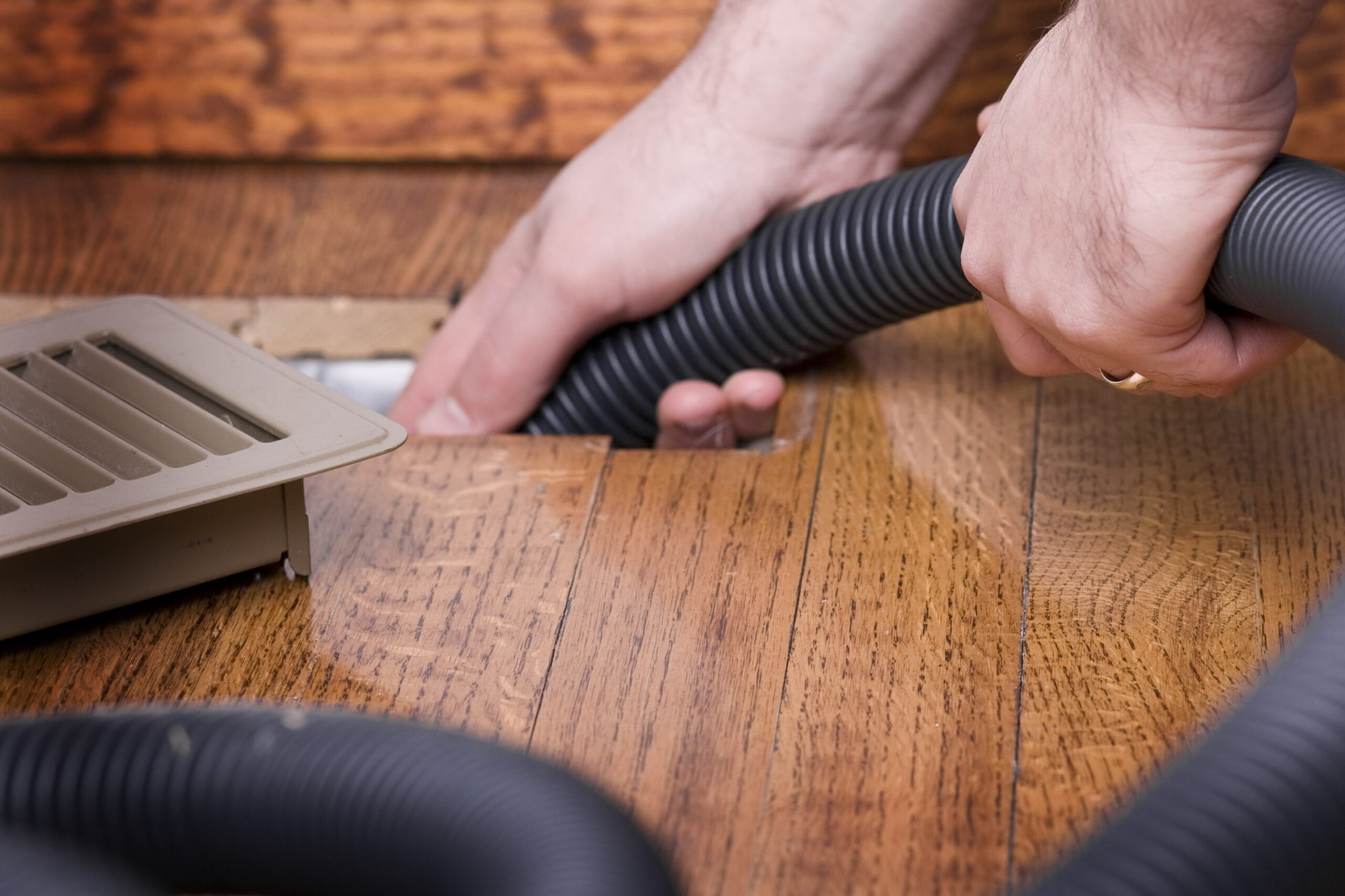 Vacuum hose in an air duct for cleaning, Blower cabinet cleaning.