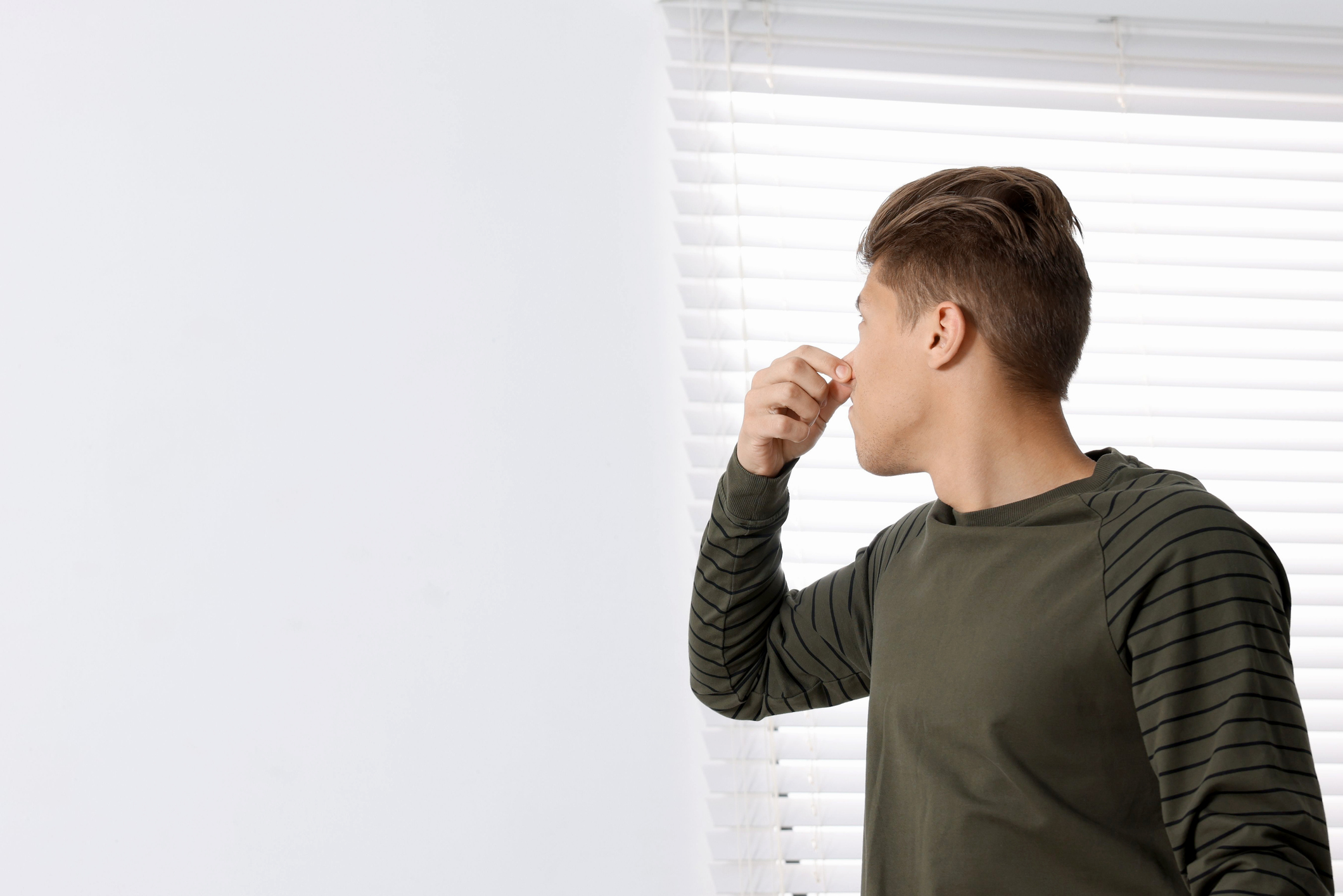 Bad smell and covering his nose indoors, HVAC maintenance.